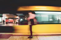 metro platform station yellow train passing by